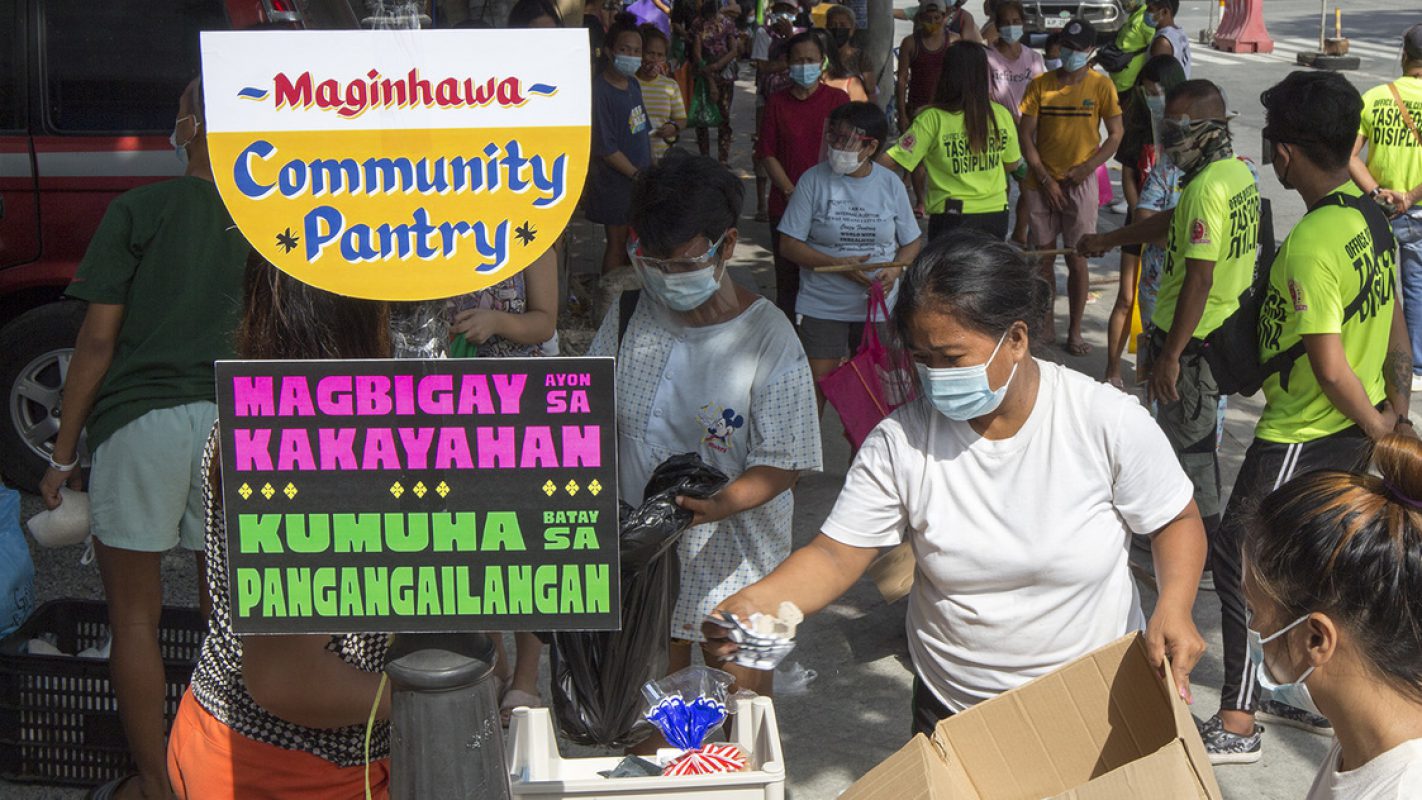 Hundreds of less fortunate individual long queue on Sunday, April 18, 2021 along Maginhawa St. in Quezon City for a free food items given from Maginhawa Community Pantry owned by a private citizen aim to help the needy during pandermic. Photo by DARREN LANGIT
